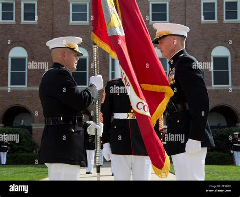 Commandant of the Marine Corps, Gen. Robert B. Neller, left, accepts ...