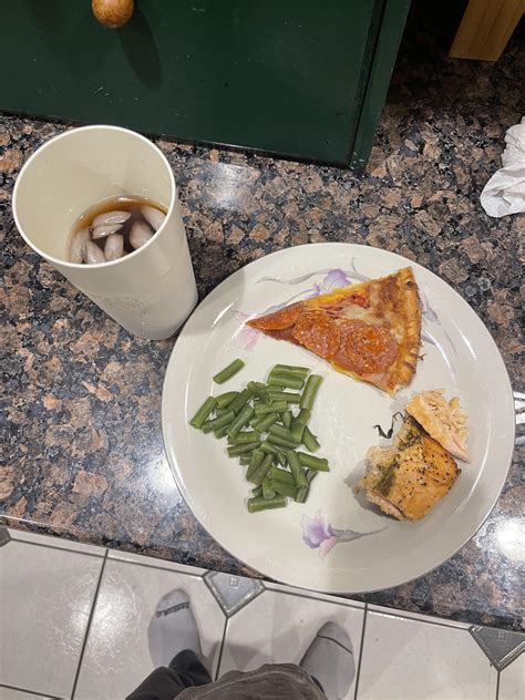 Salmon and green beans with a side of pepperoni pizza (drink is peach ...