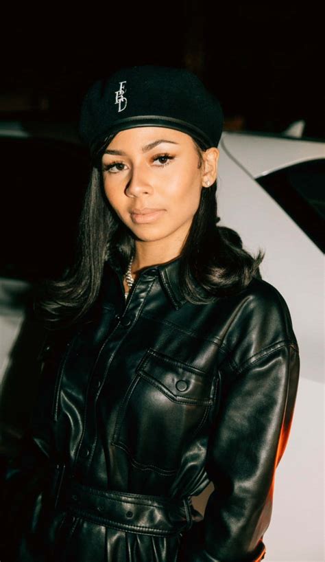 Download Stylish Womanin Black Leatherand Beret Wallpaper | Wallpapers.com