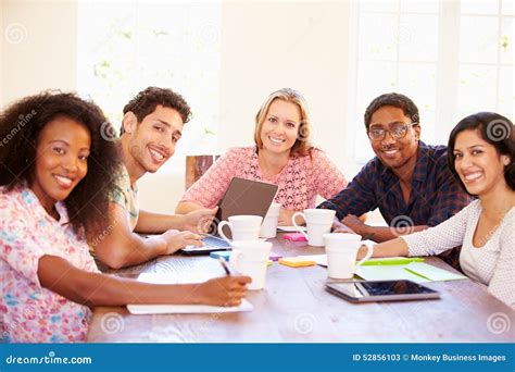 Group of Business People Sitting Around Table in Meeting Stock Image ...