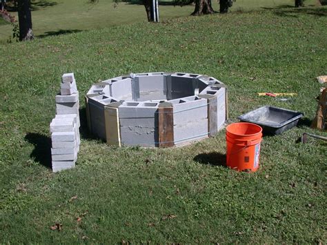 round cinder blocks, beginning of fire pit. | Cinder block fire pit ...