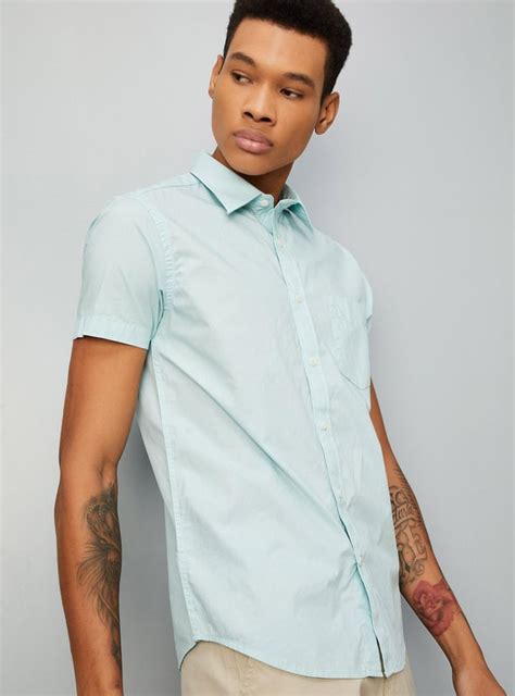 Buy Men Solid Regular Fit Smart Casual Shirt Online at just Rs. 899.0 ...