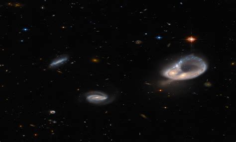 Hubble Telescope Hunts An Unusual Galaxy Twisted Into A Enormous Ring ...