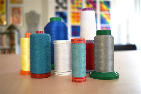 Image result for How to Use Large Thread Spool On Machine