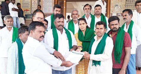 farmers' association protests in front of tahsildar's office