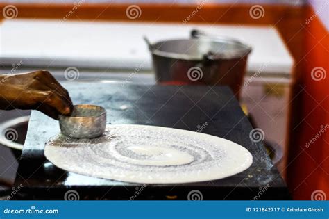 Making of Dosa on a Tawa Pan by Spreading Dosa Batter Mix of Rice and ...
