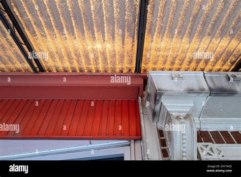 An upward view underneath an awning on old fashioned buildings Stock ...