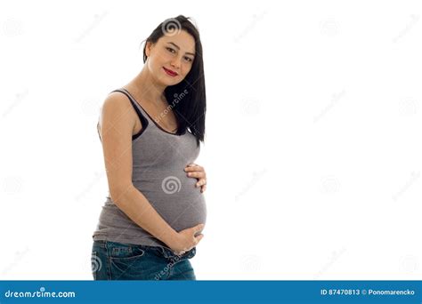 Attractive Pregnant Girl with Dark Hair Touching Her Big Belly and ...