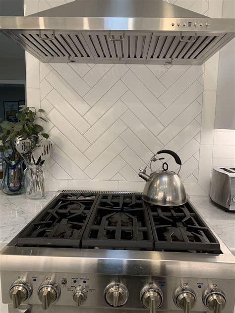 Herringbone Backsplash with White Long Subway Tile
