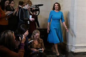 Image result for Nancy Pelosi in Blue Dress at Podium