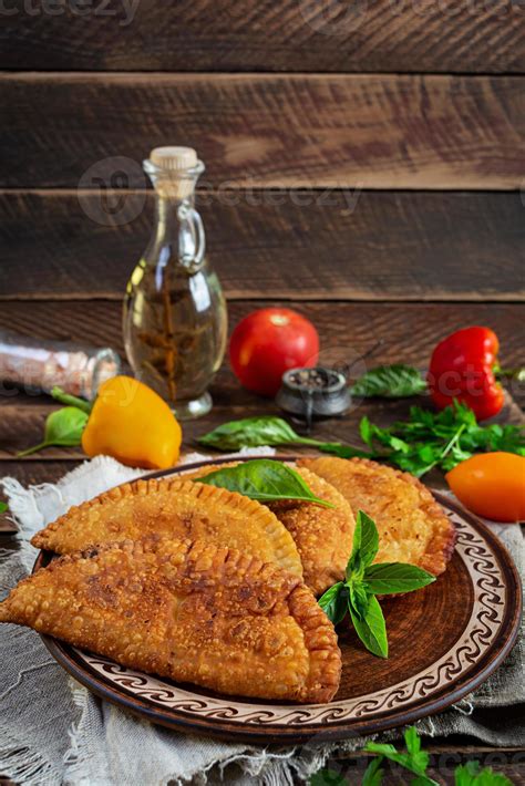 Traditional Crimean Tatar cuisine, chebureki with chicken meat. Fried ...