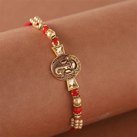 Send Golden Fancy Ganesha Rakhi Online