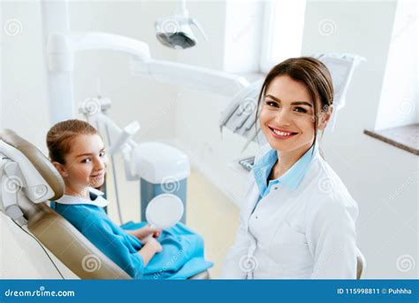 Dentistry. Dentist Doctor and Patient in Clinic Stock Image - Image of happy, high: 115998811