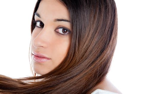 Asian brunette indian woman with long hair closeup | Premium Photo