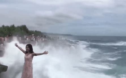 Watch | Bali tourist swept away by huge wave while posing on cliff ...