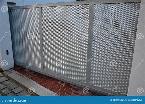 Entrance To Yard To Parking Lot through a Low Sliding Gate. Stock Photo ...