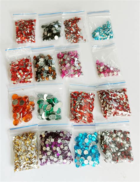 Multi colour rhinestone chandla mix colour & shapes. Pack in zipper bag ...