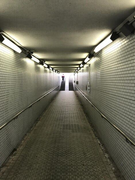 Illuminated underground walkway | Premium Photo