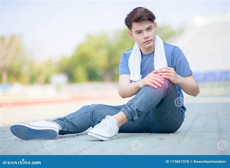 Athlete Asian Man with Knee Pain after Run on Track Stock Photo - Image ...