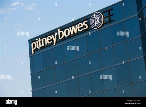 A logo sign outside of a facility occupied by Pitney Bowes Inc., in ...