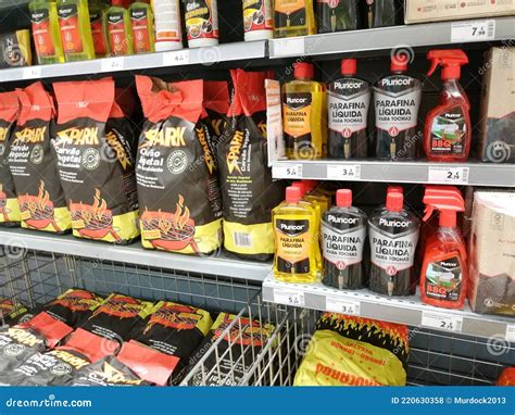 Barbecue Charcoal Chimney Starter On A Black Tripod Swivel Grill Stock ...