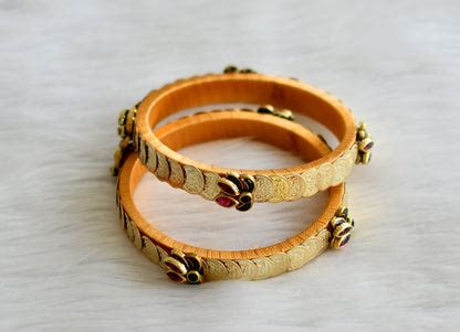 Gold tone silk thread pink-green stone kundan lotus lakshmi coin banga ...