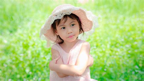 Positive charming 4 years old cute baby Asian girl, little preschooler ...