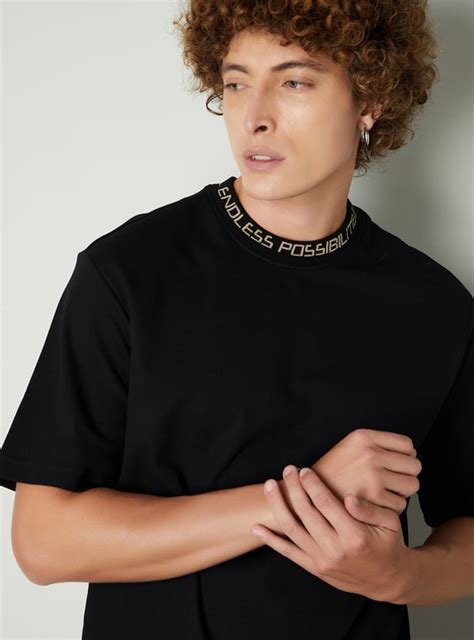 Buy Men Solid Relaxed Fit T-shirt Online at just Rs. 799.0 ...