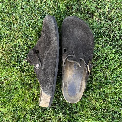 Dark brown Birkenstock clogs. Wear on the inside of... - Depop