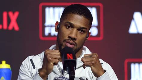 MIAMI, FLORIDA - DECEMBER 19: Anthony Joshua speaks at a press conference after Jake Paul v Anthony Joshua at Kaseya Center on December 19, 2025 in Miami, Florida. (Photo by Carmen Mandato/Getty Images for Netflix)
