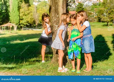 Little Girls Playing in the Park and Whispering Stock Photo - Image of ...