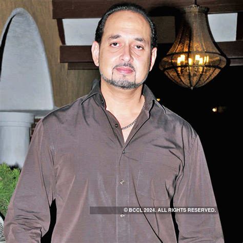 Shooter Hyder Khan strikes a pose for the cameras during a dinner bash ...
