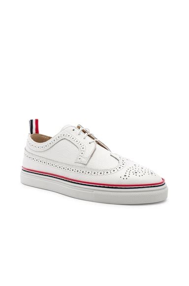 Thom Browne Brogue Sneaker in White | FWRD