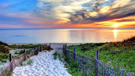 Path with fence to a beach at sunset near Provincetown on Cape Cod ...