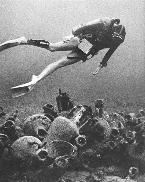 - Age-crusted amphorae, like jumbled tombstones,...