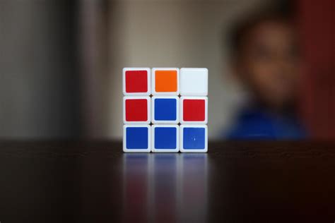 Rubik's cube on the black background. Rubik's Cube was invented by Hungarian architect Erno ...