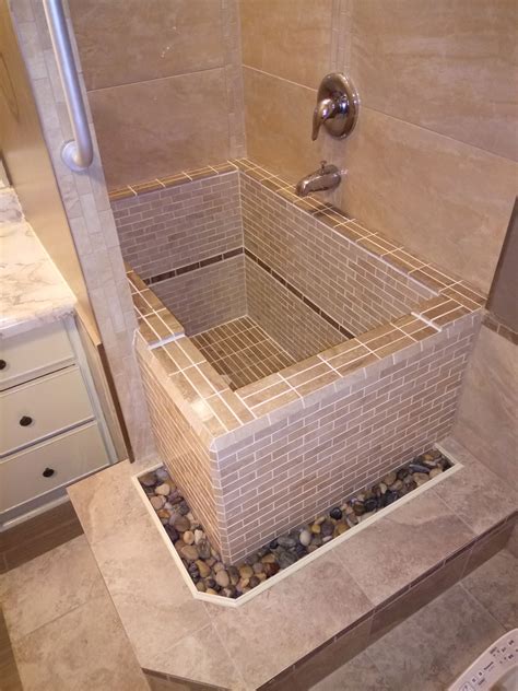 Roman style concrete deep soaking tub with tiles . | Concrete bathtub ...