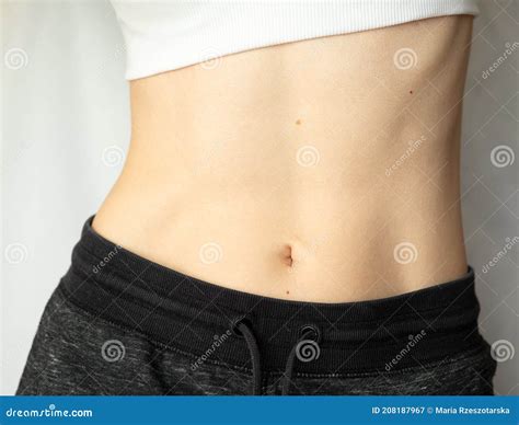 Woman Showing Her Flat Belly. Stock Image - Image of female, flat: 208187967