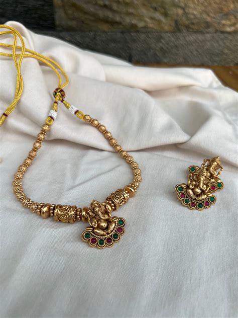 Antique matte Ganesha kemp necklace with studs – House of Jhumkas