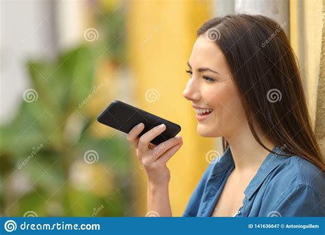 Girl Using Voice Recognition On Phone In A Colorful Street Stock Image ...