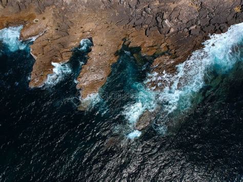 Aerial shots of the turquoise water, reef formations, beach and shipwreck at Henrietta Rocks.