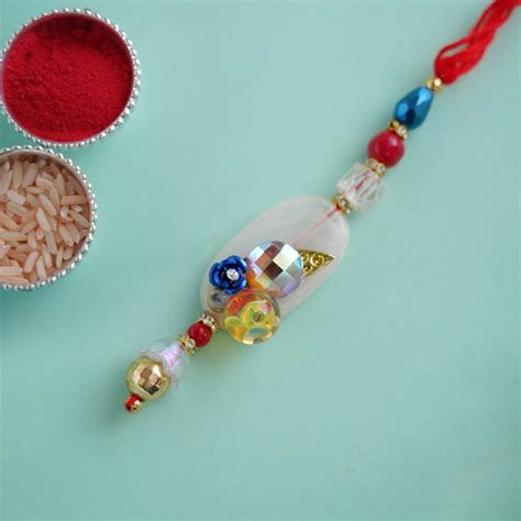 Send Shiny Beaded Lumba Rakhi - Japan Online | Rakhibazaar.com