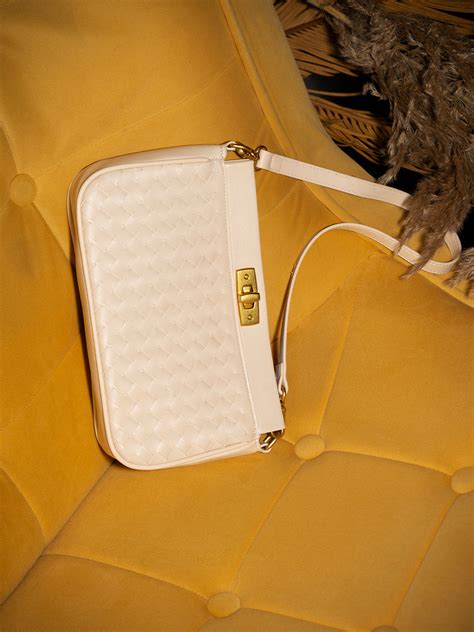 Buy Now Womens Cream Textured Sling Bag With Twist Lock