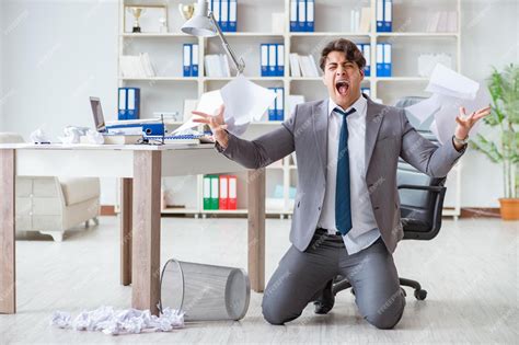 Angry businessman shocked working in the office fired sacked | Premium ...
