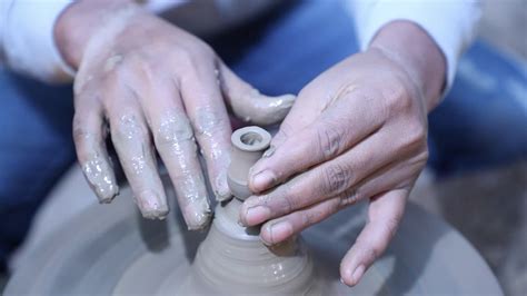 Close up view of potter making clay pot. 20928679 Stock Video at Vecteezy