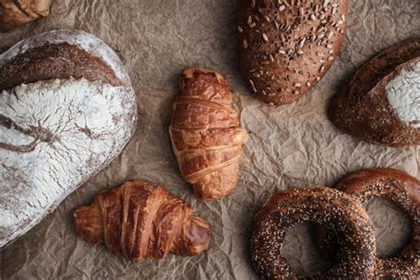 Pastries and bread with flour on table | Premium Photo