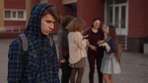 Group Of Students Making Fun Of Shy Classmate Stock Footage SBV ...