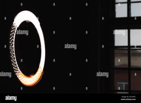 Circular LED light glowing in dark photo studio Stock Photo - Alamy
