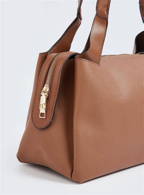 Buy Women Textured Shoulder Bag Online at just Rs. 1299.0 ...