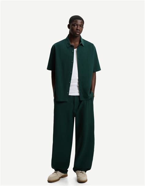 Pleated baggy jogger trousers - Men | Bershka